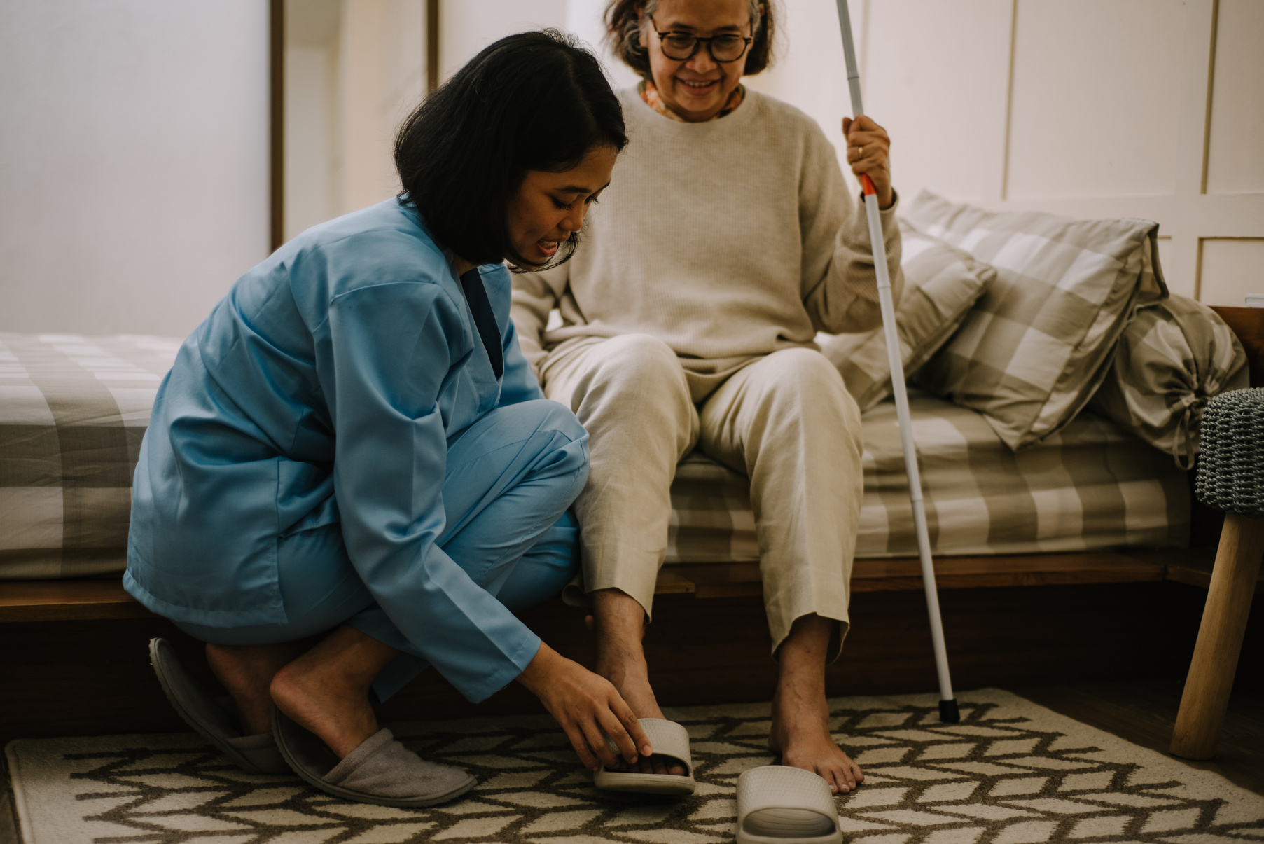 Nurse Taking Care of an Elderly Woman 